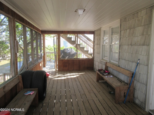 sunroom featuring wood ceiling