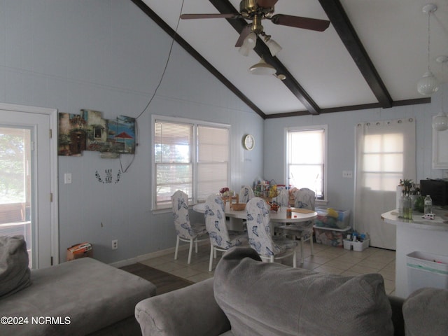 tiled dining area with vaulted ceiling with beams and ceiling fan