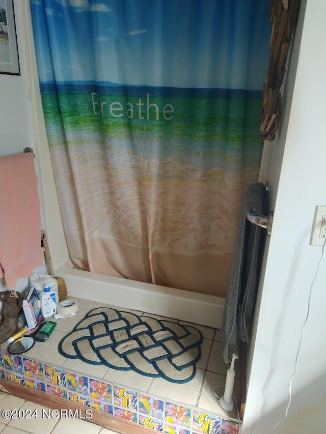 bathroom featuring tile flooring