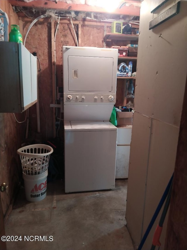 laundry area with stacked washing maching and dryer