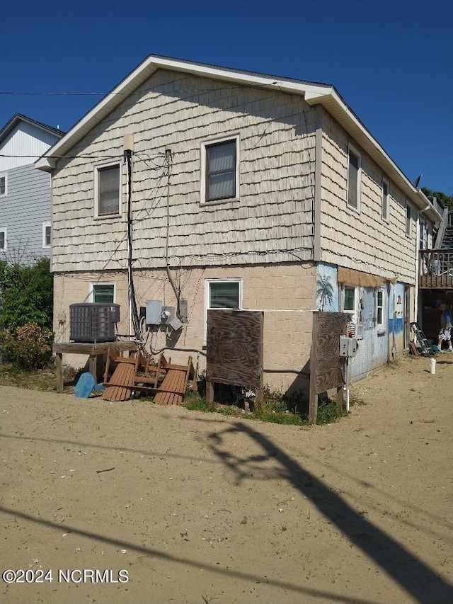 exterior space featuring central AC unit