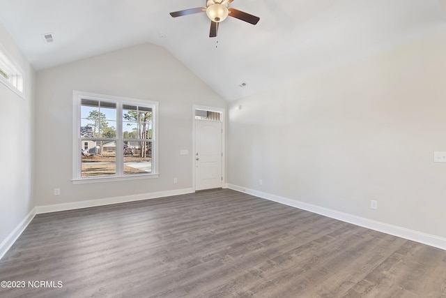 unfurnished room with dark hardwood / wood-style flooring, plenty of natural light, lofted ceiling, and ceiling fan