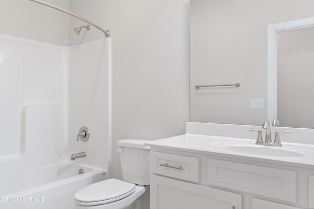 full bathroom featuring vanity, toilet, and washtub / shower combination