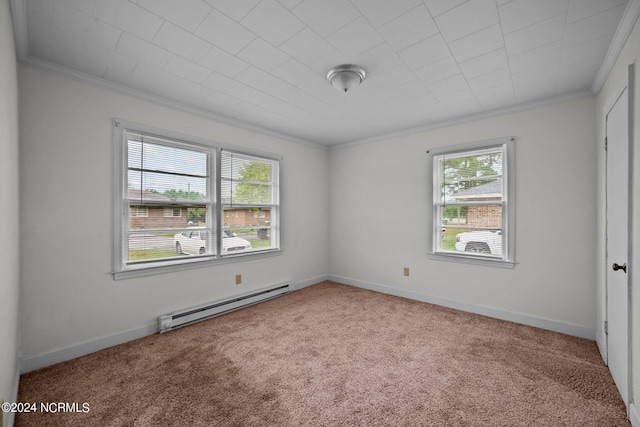 carpeted spare room with baseboards, baseboard heating, and crown molding