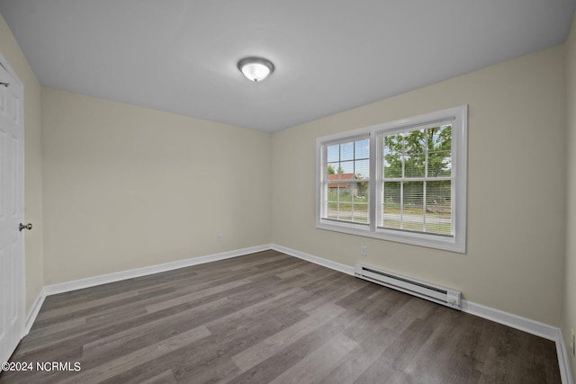 unfurnished room featuring light wood-type flooring, a baseboard radiator, and baseboards