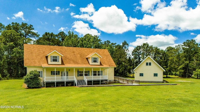 exterior space featuring a porch and a lawn