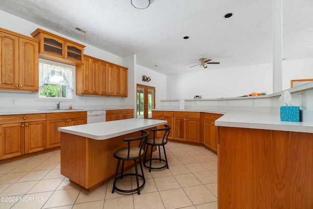 kitchen featuring sink, plenty of natural light, ceiling fan, and white dishwasher