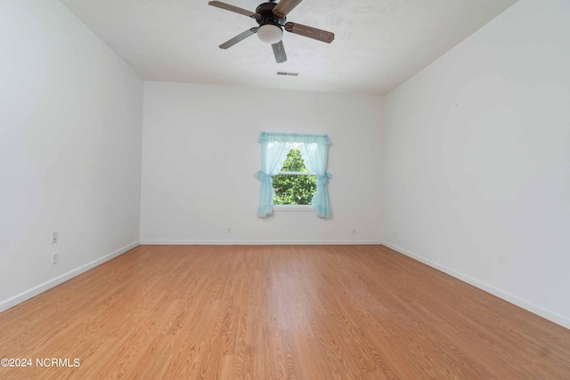 spare room with ceiling fan and light hardwood / wood-style floors