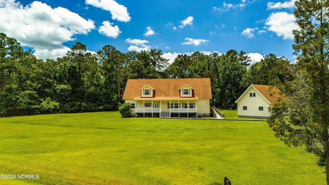 view of front of home with a front yard and a porch