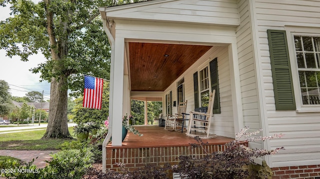 wooden terrace with a porch