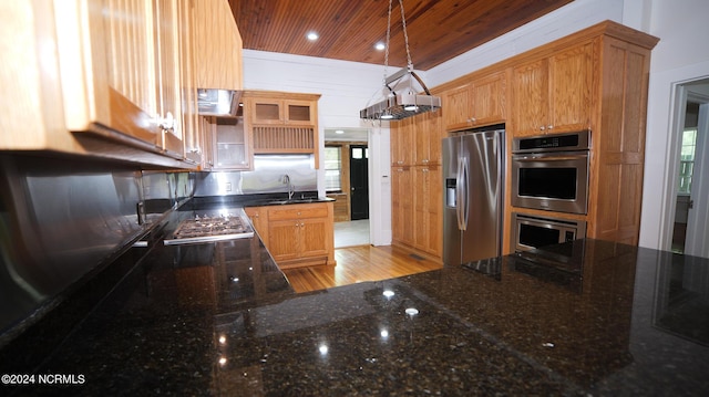 kitchen featuring wooden ceiling, recessed lighting, stainless steel appliances, a sink, and dark stone counters