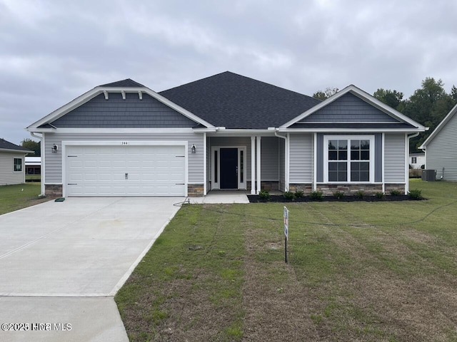 craftsman-style home featuring a garage and a front yard