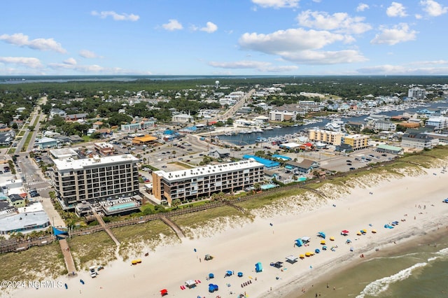 bird's eye view featuring a view of the beach and a water view