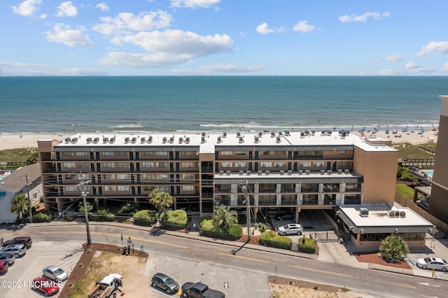 bird's eye view with a beach view and a water view