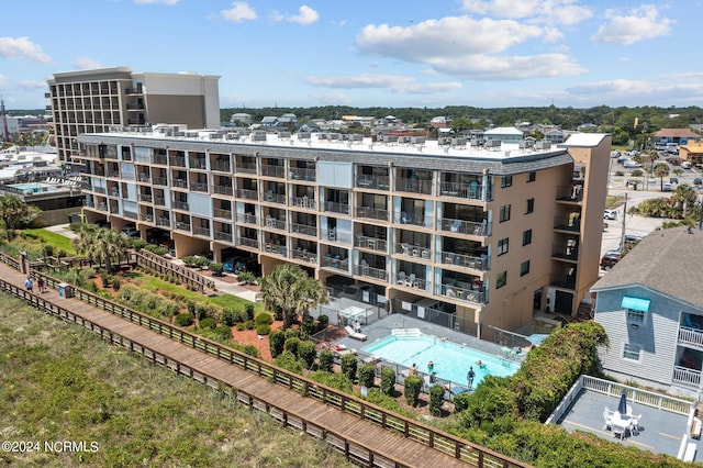 view of property featuring a community pool