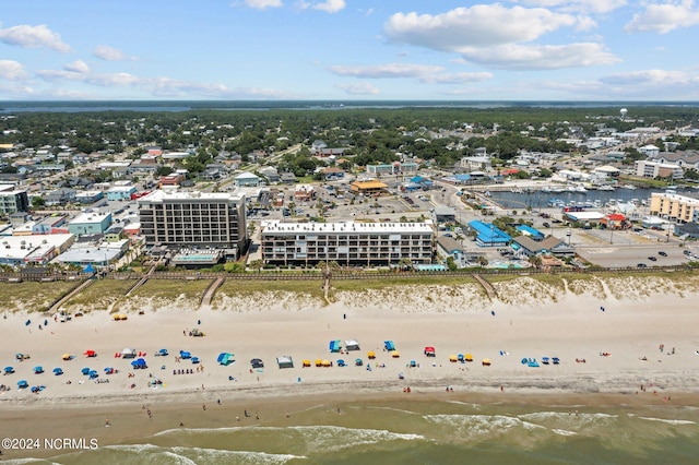 bird's eye view featuring a water view and a view of the beach