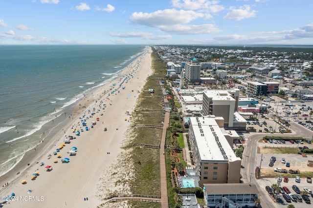 drone / aerial view featuring a view of the beach and a water view