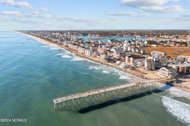 birds eye view of property featuring a view of the beach and a water view