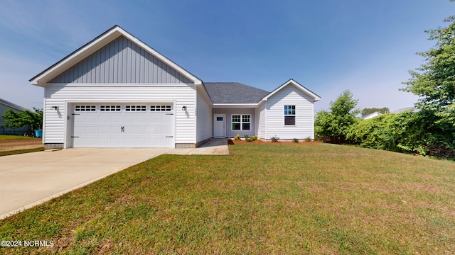 view of front of property with a garage and a front yard