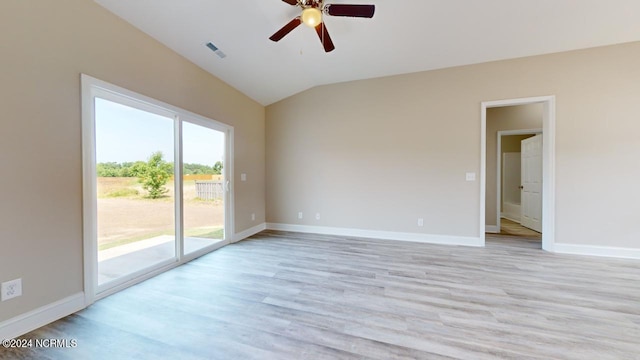 spare room featuring ceiling fan, light hardwood / wood-style flooring, and vaulted ceiling