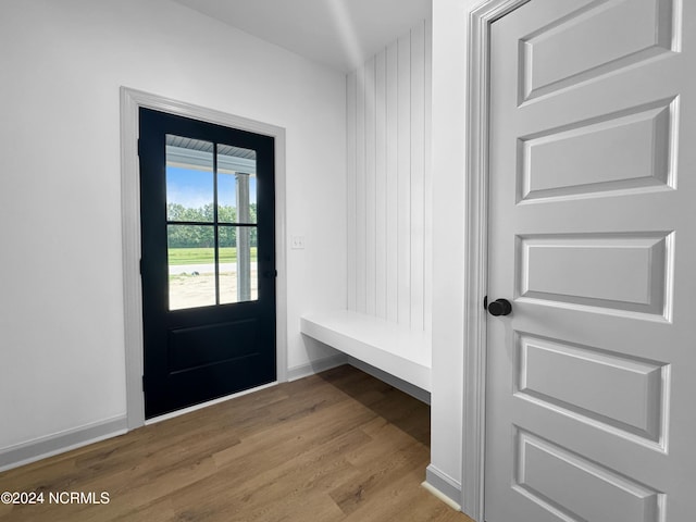 mudroom featuring wood finished floors and baseboards