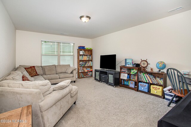 living room featuring carpet and visible vents