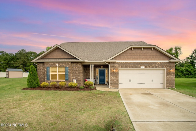 craftsman-style home featuring a shed, a garage, brick siding, concrete driveway, and a front lawn