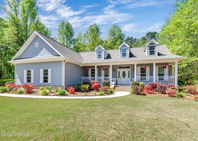 227 October Glory Dr, Wallace, NC 28466 - view of front of house featuring a front yard, a porch, and roof with shingles