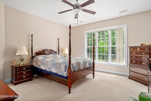 bedroom with light colored carpet and ceiling fan