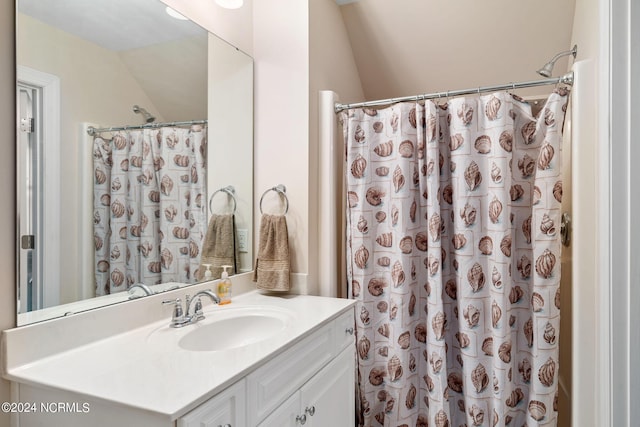 227 October Glory Dr, Wallace, NC 28466 - full bathroom with vanity, vaulted ceiling, and a shower with curtain