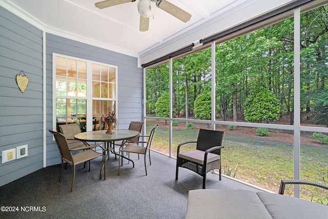 sunroom / solarium with ceiling fan