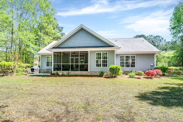 227 October Glory Dr, Wallace, NC 28466 - back of house featuring ceiling fan, a sunroom, a yard, and a shingled roof