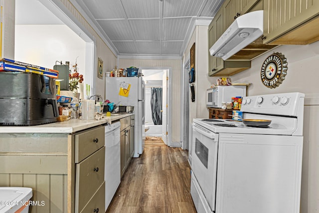 kitchen with white appliances, sink, and light hardwood / wood-style flooring