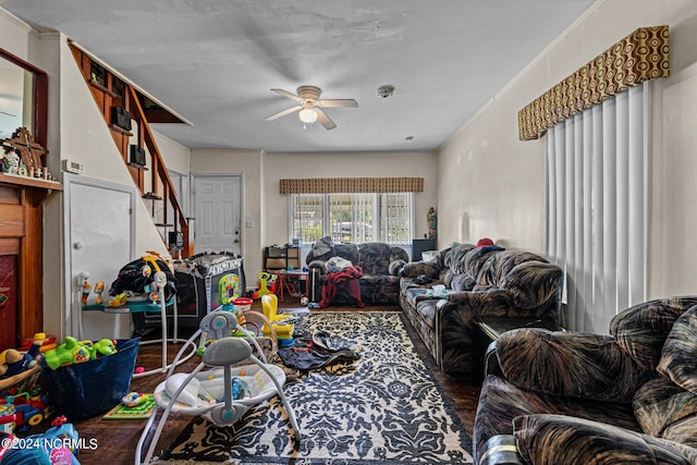 living room with crown molding, ceiling fan, and hardwood / wood-style floors