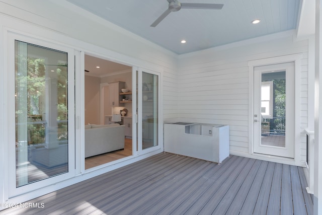 wooden deck featuring ceiling fan