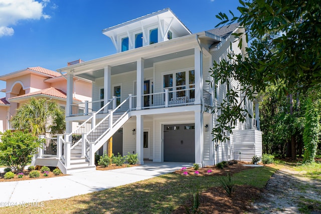 view of front facade with covered porch and a garage