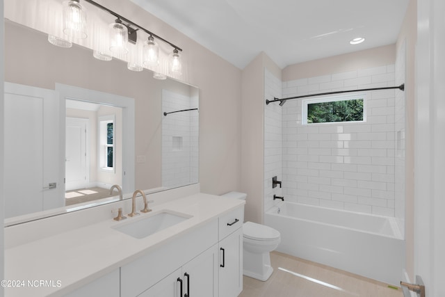 full bathroom featuring tile patterned floors, vanity, toilet, and tiled shower / bath