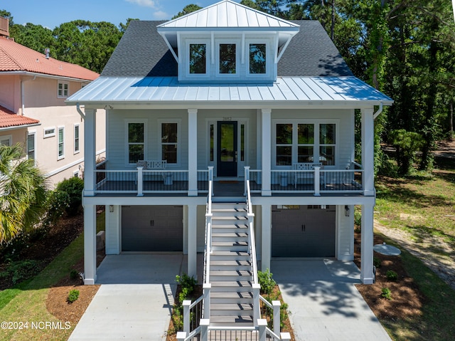 view of front facade with a garage and covered porch