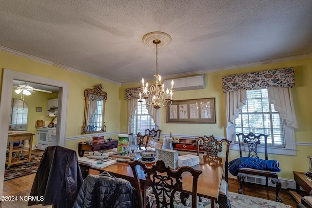 dining area with ornamental molding, a wall mounted air conditioner, and wood finished floors