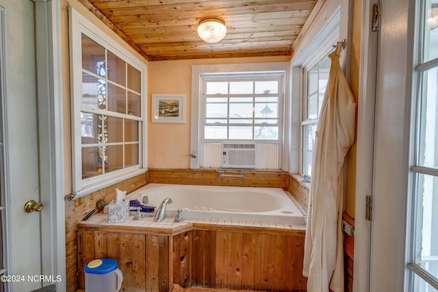 full bath featuring cooling unit, a garden tub, and wood ceiling
