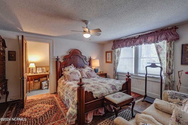 bedroom with a textured ceiling, a ceiling fan, and wood finished floors