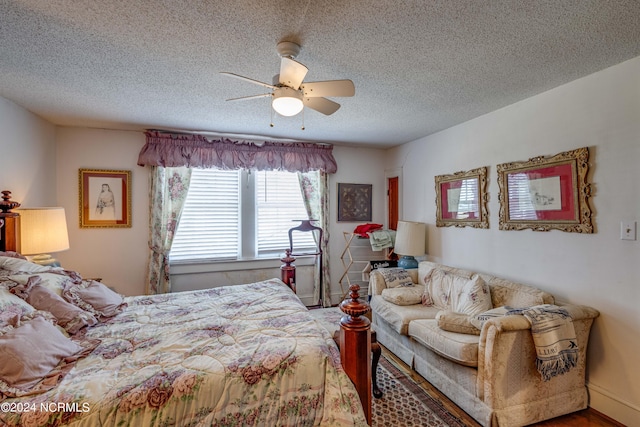 bedroom featuring a textured ceiling and a ceiling fan