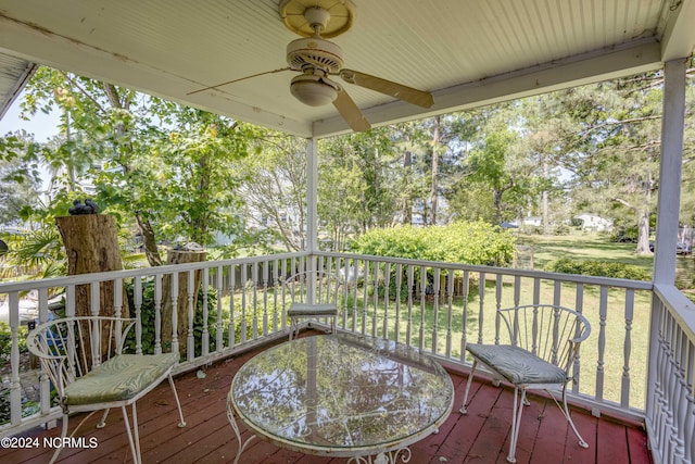 wooden terrace featuring a ceiling fan