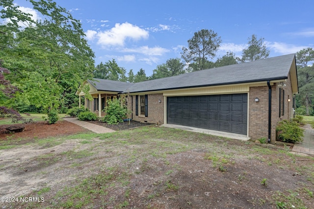 ranch-style house featuring a garage