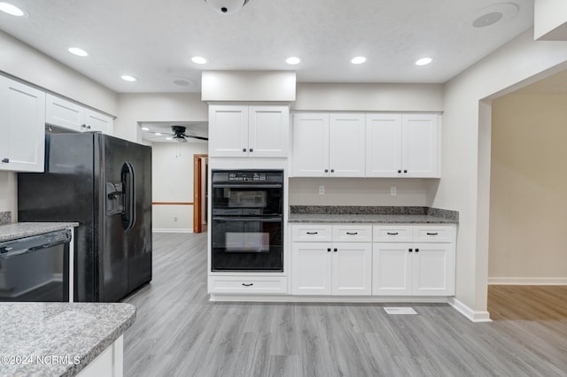 kitchen featuring white cabinetry, black appliances, ceiling fan, and light wood-type flooring