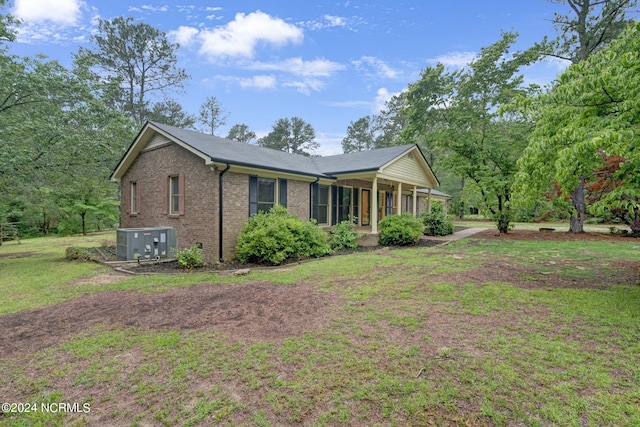 rear view of house with a lawn