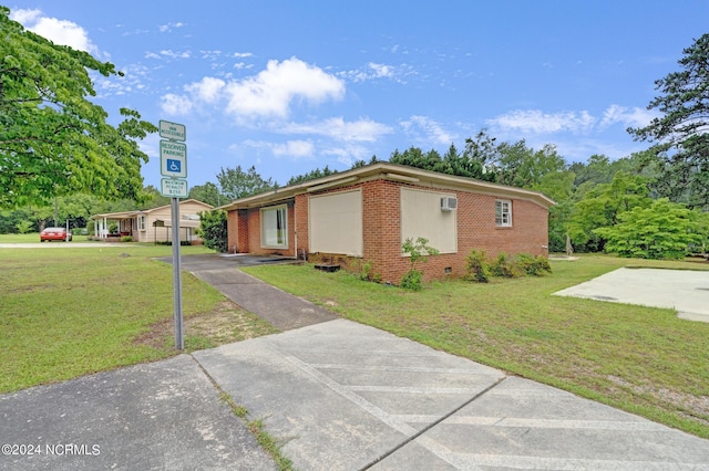 view of property exterior featuring a lawn