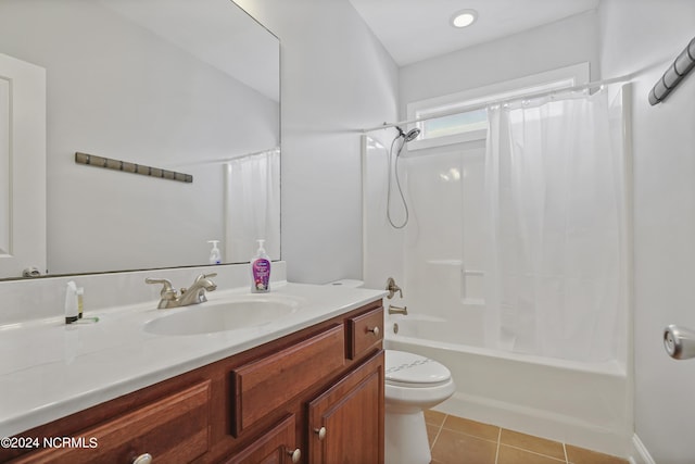 full bathroom with toilet, tile patterned flooring, vanity, and shower / tub combo with curtain