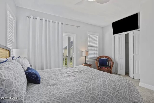 bedroom with ceiling fan and light colored carpet