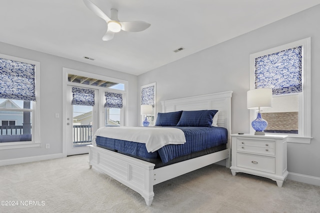 bedroom featuring access to outside, ceiling fan, and light carpet